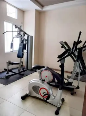 a room with a gym with a exercise bike at Close by landmarks and airport in Manila