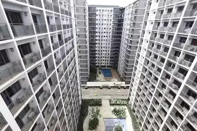 an aerial view of tall buildings in a city at The Nuebe Chalet near SM Moa Pasay City in Manila