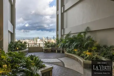 a balcony of a building with a view of the city at Condo Unit at La Verti Residences in Manila