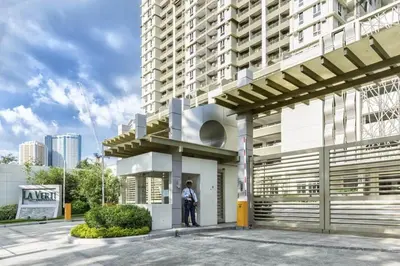 a man standing in front of a building at Condo Unit at La Verti Residences in Manila