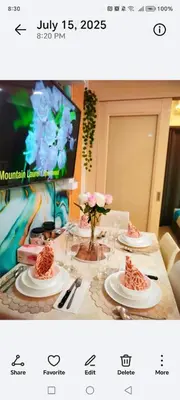 a picture of a table with plates of food on it at Comfystay at Sea Residences tower C in Manila
