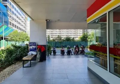 a group of motorcycles parked in a building at Comfystay at Sea residences 2 bedrooms in Manila