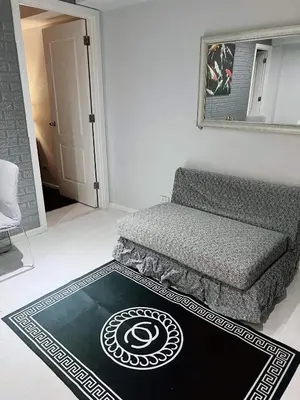 a living room with a couch and a rug at 2bedroom azure beachview 7 in Manila