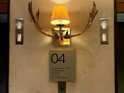 a light with antlers attached to a wall at Sky Piea at Knightsbridge Residences - APARTMENT with Gym Sauna Pool in Manila