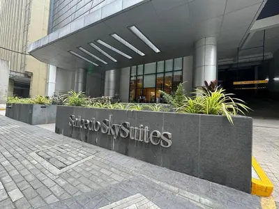 a building with a sign in front of it at Apartment in Salcedo village, Makati City in Manila