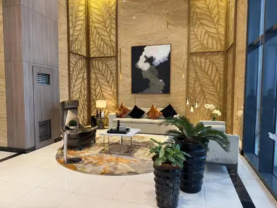a living room with a couch and a table at Apartment in Salcedo village, Makati City in Manila