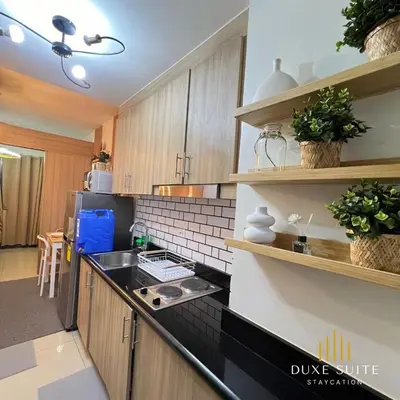 a kitchen with a sink and a counter top at Aesthetic walking distance to MOA,near NAIA AIRPORT with NETFLIX,MINIVIDEOKE,BOARDGAMES-DUXE9 in Manila
