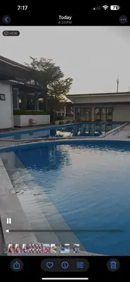 a view of a swimming pool on a television screen at Transient Room in Dasmariñas