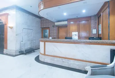 a bar in a large room with a counter at RedDoorz at MPT Suites Test in Manila