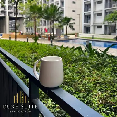 a white coffee cup sitting on a bench at Aesthetic walking distance to MOA,near NAIA AIRPORT with NETFLIX,MINIVIDEOKE,BOARDGAMES-DUXE5 in Manila