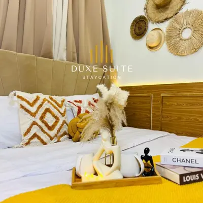 a tray with a coffee mug on a bed at Aesthetic walking distance to MOA,near NAIA AIRPORT with NETFLIX,MINIVIDEOKE,BOARDGAMES-DUXE5 in Manila