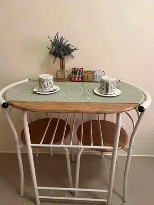 a table with two cups and saucers on it at Aesthetic Studio Unit at Deca Cubao QC in Manila