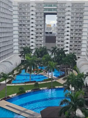 a view of the pool from the apartment building at Staycation with Netflix in Shell Residences in Manila