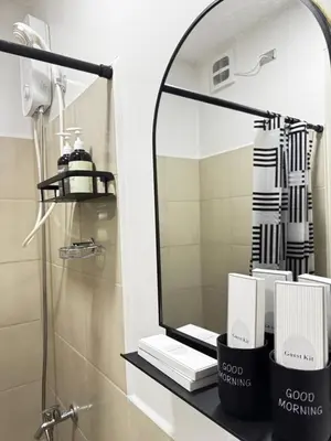 a bathroom with a mirror and a sink at Casa Dreamer in Taytay