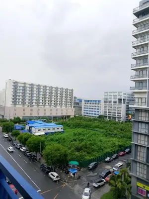 a view of a parking lot in a city with buildings at Tower C sea residence manolita in Manila
