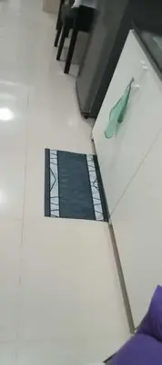 a view of a floor with a green shoe on it at Tower C sea residence manolita in Manila