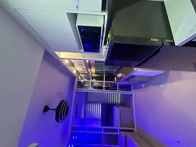 an empty room with purple lights on the ceiling at Shore 2 tower 1 staycation in Manila