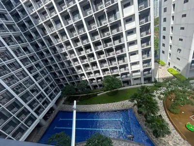 an overhead view of a large apartment building with a pool at Shore 2 tower 1 staycation in Manila