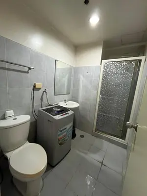 a bathroom with a toilet and a sink at Sea Residences Spacious Unit by Ellenn in Manila
