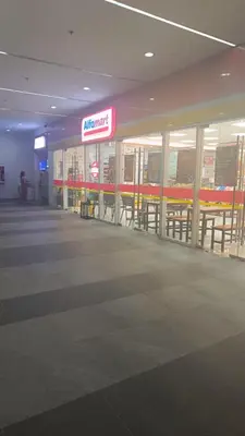 a store with tables and chairs in a building at Cozy Space at Red Makati City in Manila