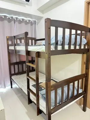 a couple of bunk beds in a room at Unistay Shore 3 Tower 2 10th floor near MOA and AIRPORT in Manila