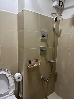 a bathroom with a shower stall with a toilet at Unistay Shore 3 Tower 2 10th floor near MOA and AIRPORT in Manila