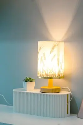 a lamp on a table with a plant on it at Urban Stay with Netflix KTV Wifi and Gym Park in Manila