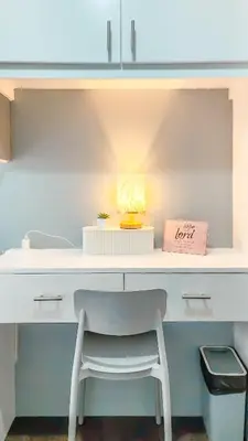 a white desk with a chair in a room at Urban Stay with Netflix KTV Wifi and Gym Park in Manila