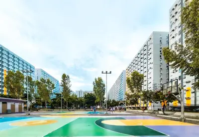 a basketball court in a city with tall buildings at Urban Stay with Netflix KTV Wifi and Gym Park in Manila