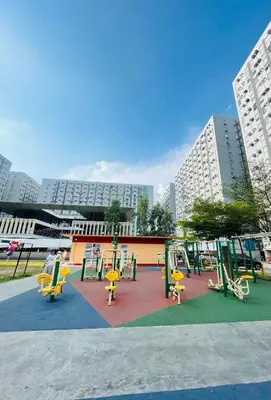a playground in a city with yellow chairs and buildings at Urban Stay with Netflix KTV Wifi and Gym Park in Manila
