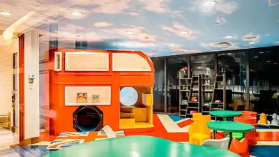 a room with a toy bus on the wall at Poblacion Stay with Pool Gym Jacuzzi and Pool Table in Manila