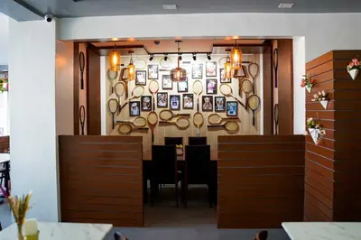 a dining room with a table and plates on the wall at OYO 1168 Gimaca Boutique Hotel & Cafe in Manila