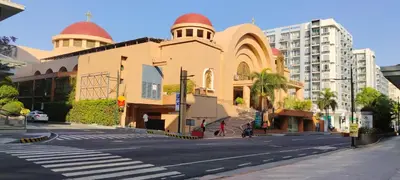 a building with two domes on the side of a street at Cozy condy at One palm villa across NAIA T3 in Manila