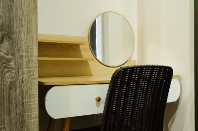 a mirror sitting on top of a desk with a chair at Shore 2 Residences near MOA, NAIA, PITX in Manila
