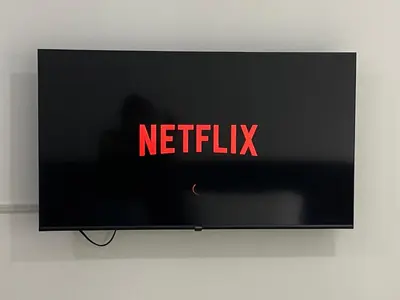 a television screen with the netflix sign on it at Bright Condo-Gentry Manor 2 mins to Okada - 6G in Manila