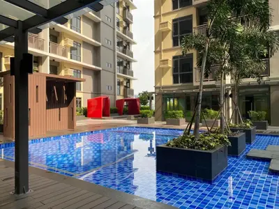 a swimming pool in the middle of a building at Bright Condo-Gentry Manor 2 mins to Okada - 6G in Manila