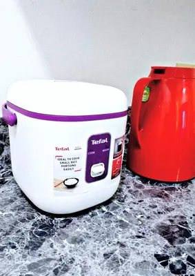 a white toaster and a red mixer on a counter at Azure Staycationcation by Nairah in Manila