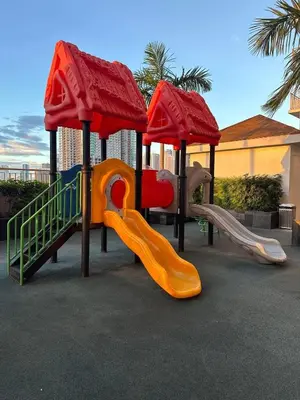 a group of playground equipment with slides and a play structure at Jessa Rios Coast Staycation 2 in Manila