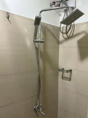 a shower with a shower head in a bathroom at 1 Bedroom Shore Residences 2 For Rent in Manila