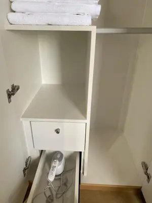 a white cabinet with a white towel on it at Bright Unit with Balcony near Okada & Airport-6C in Manila