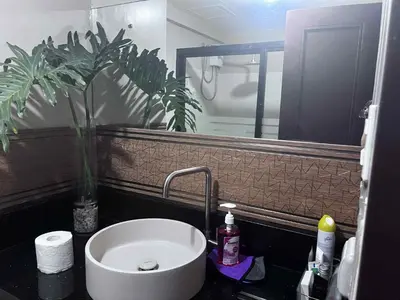 a bathroom with a sink and a mirror at The Haru at Arista in Manila
