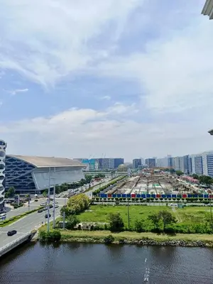 a view of a city with a bridge and a river at WP1015 with Balcony in Manila
