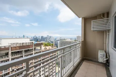 a balcony with a view of the city at fairlane 1bed room in Manila