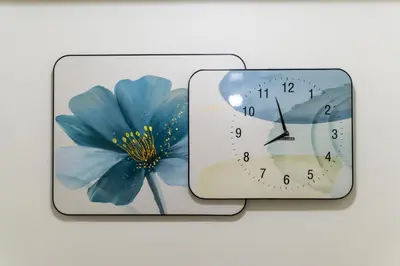 a clock with a picture of a blue flower on it at fairlane 1bed room in Manila
