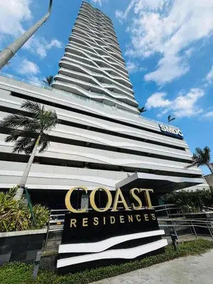a large building with a sign in front of it at Near SM MOA in Manila