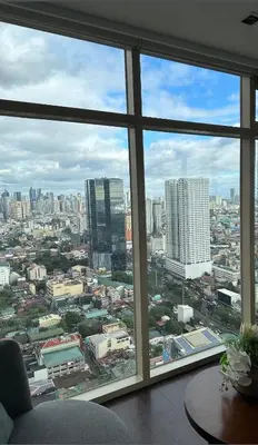 a view of a city from an office window at Near SM MOA in Manila
