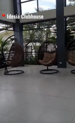 a group of chairs sitting in front of a building at Von Home Sweet Home in Dasmariñas