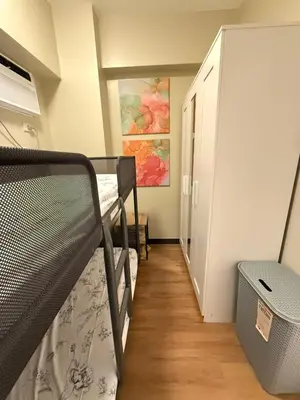 a room with a bunk bed and a hallway at Aesthetic Cozy Modern Condo Apartment in Manila