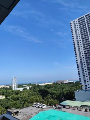 a view of the ocean from the balcony of a building at Condotel-Coast Residences in Manila