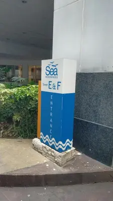 a sign sitting on the side of a building at Rdhee Condotel NEAR SMX MOA in Manila